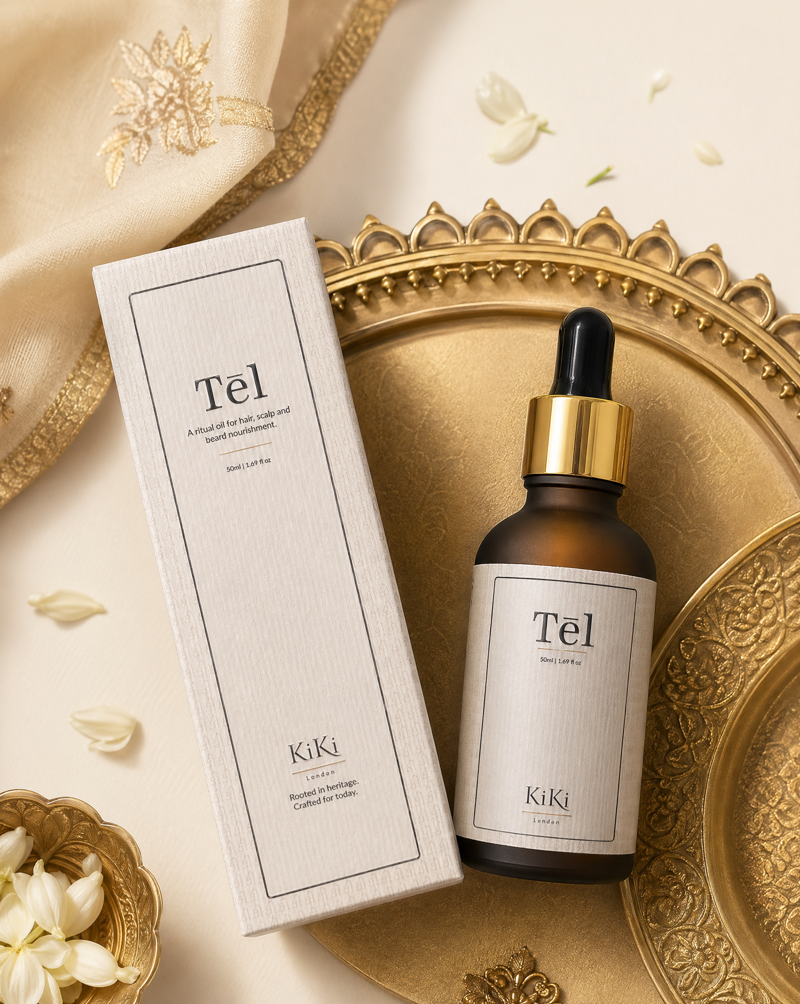KiKi London Tel skincare product with dropper and packaging on a decorative tray with flowers.